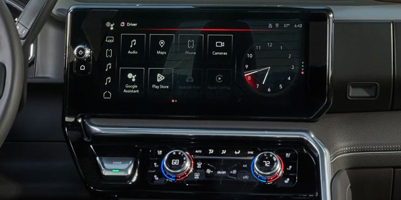 Dashboard touchscreen in the 2026 GMC Sierra HD providing access to connected services, navigation, and safety technologies.